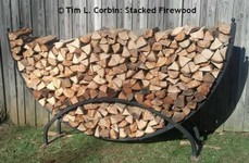 Circular bin of stacked firewood.